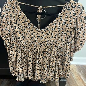Cheetah print women’s shirts. Size small.